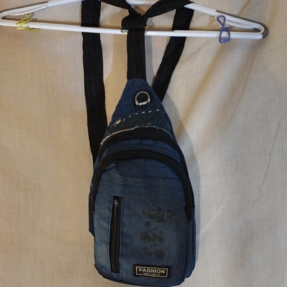 Blue and Black Backpack with Adjustable Straps and Durable Fabric - Picture 1 of 8